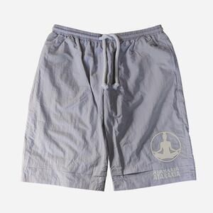 Ataraxia gray baggy shorts with white circular logo featuring a meditating figur